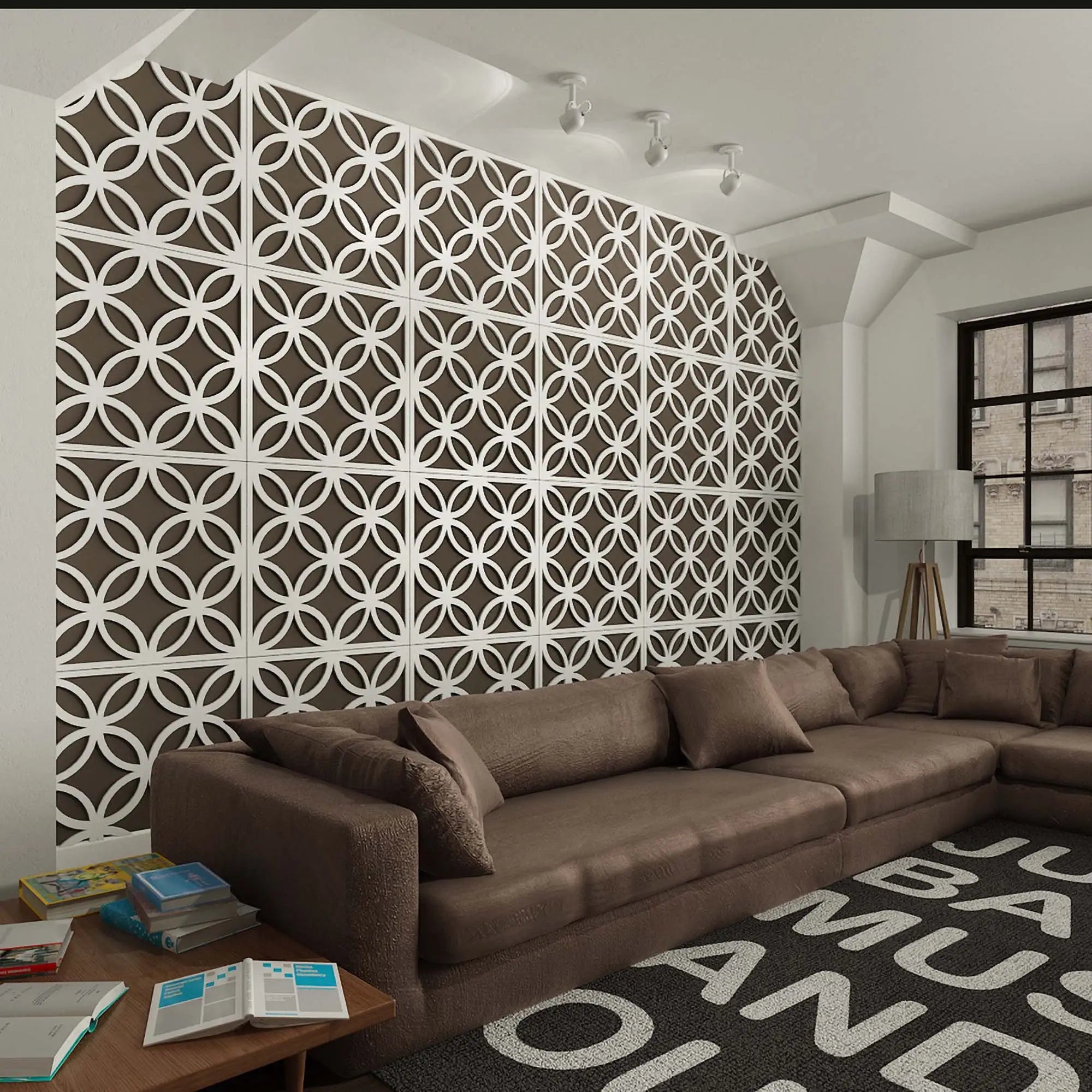 Brown sectional sofa in a room with decorative wall panels and books on a table.