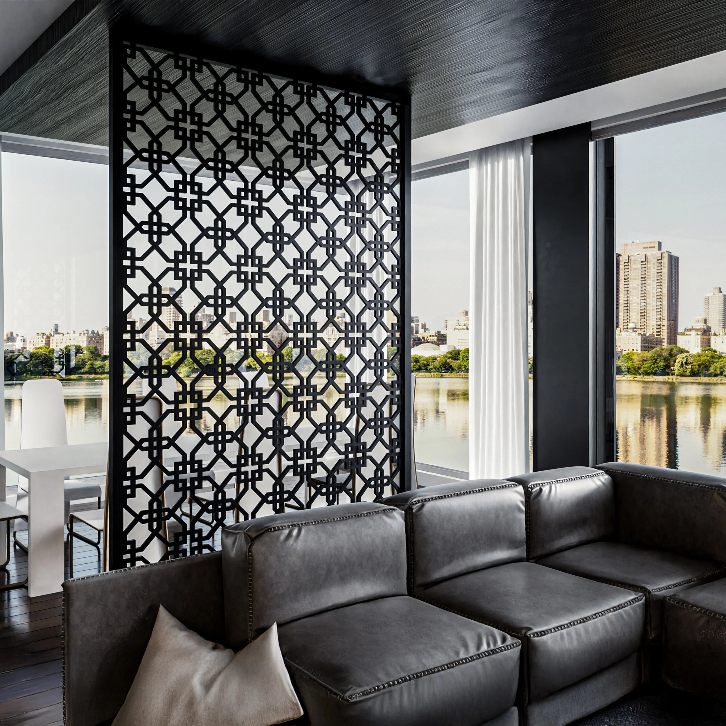 Modern living room with a black sofa and decorative screen by a large window with a city view.