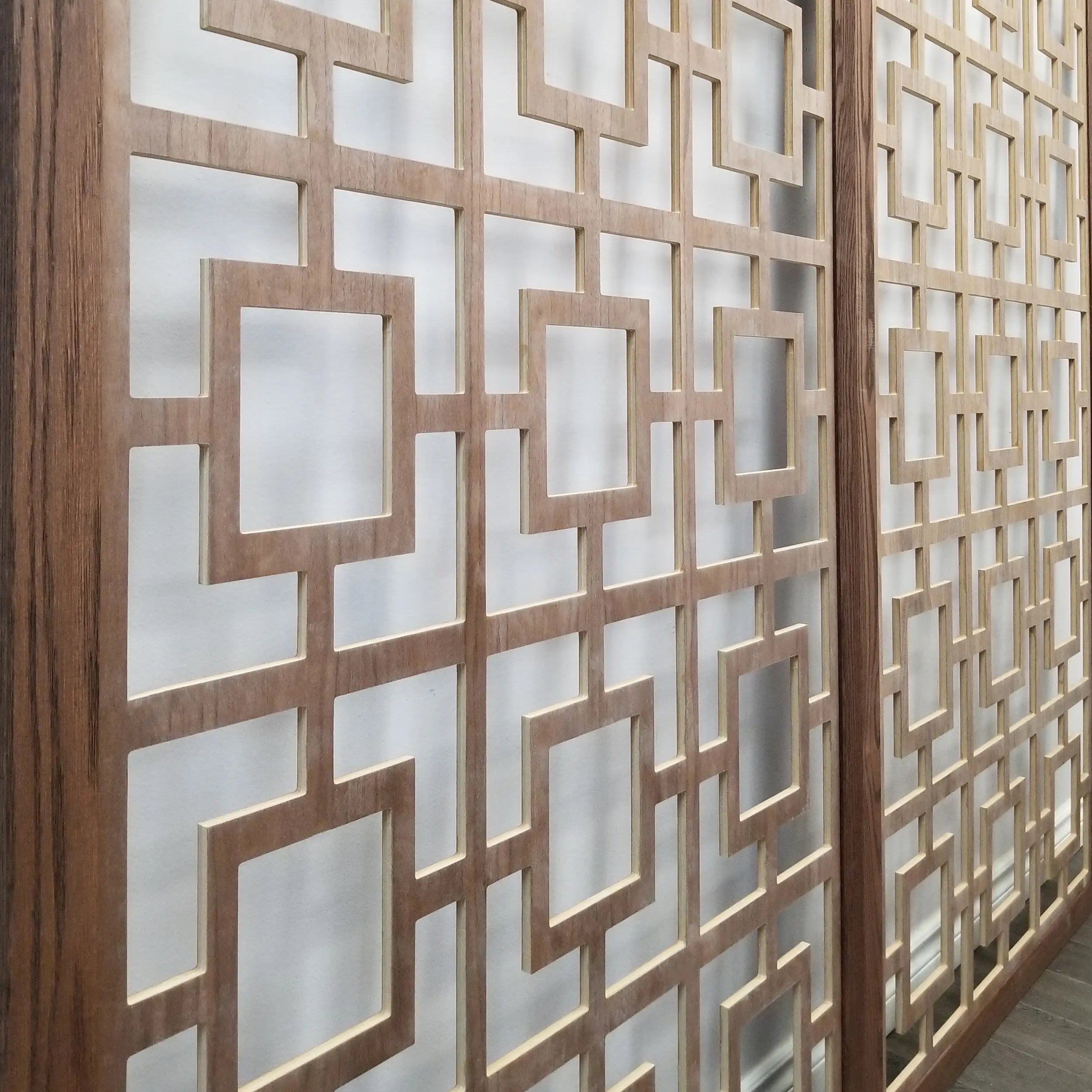 Decorative wooden privacy screen with geometric pattern