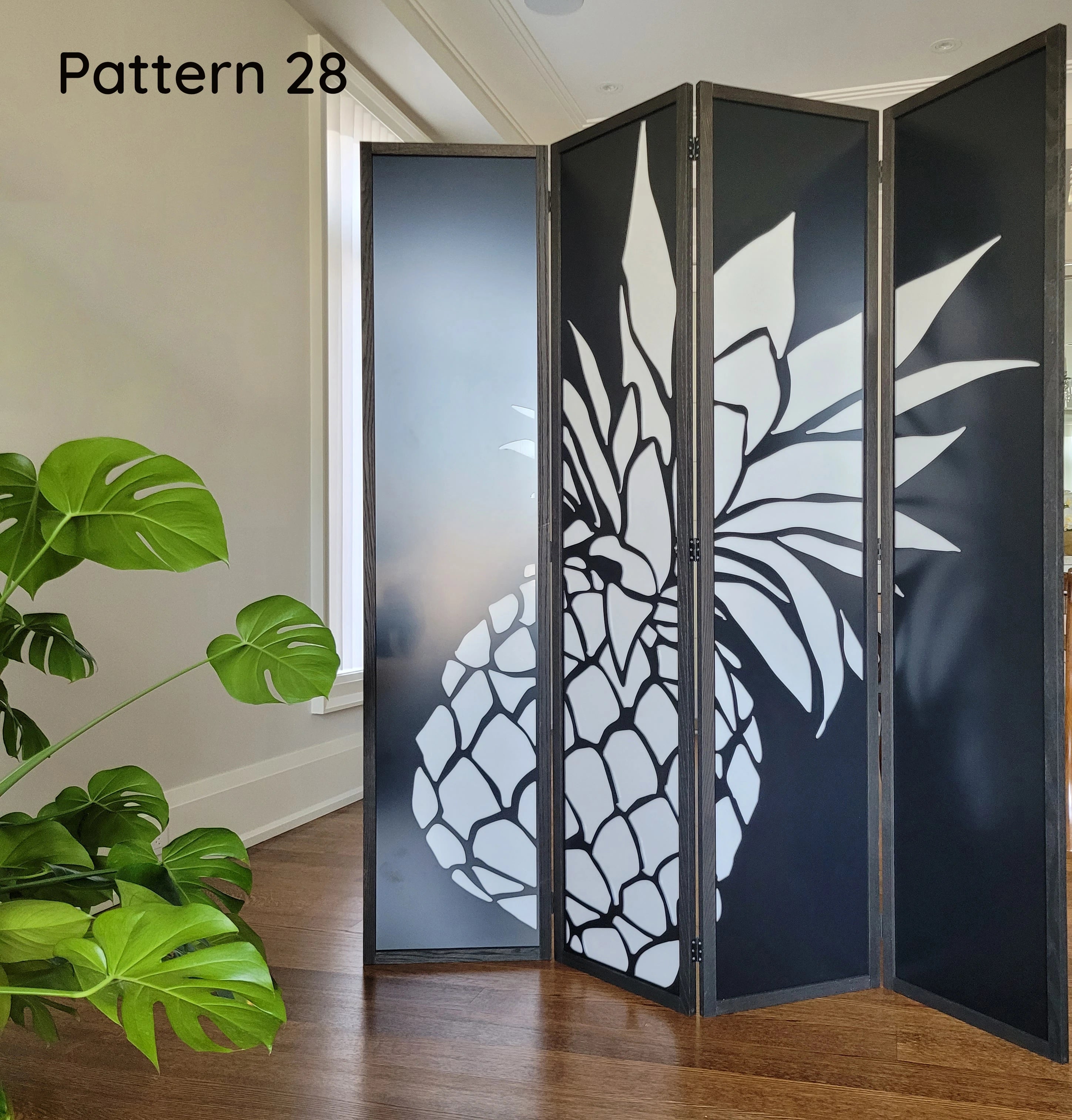 Room divider with decorative pattern in a room with a plant