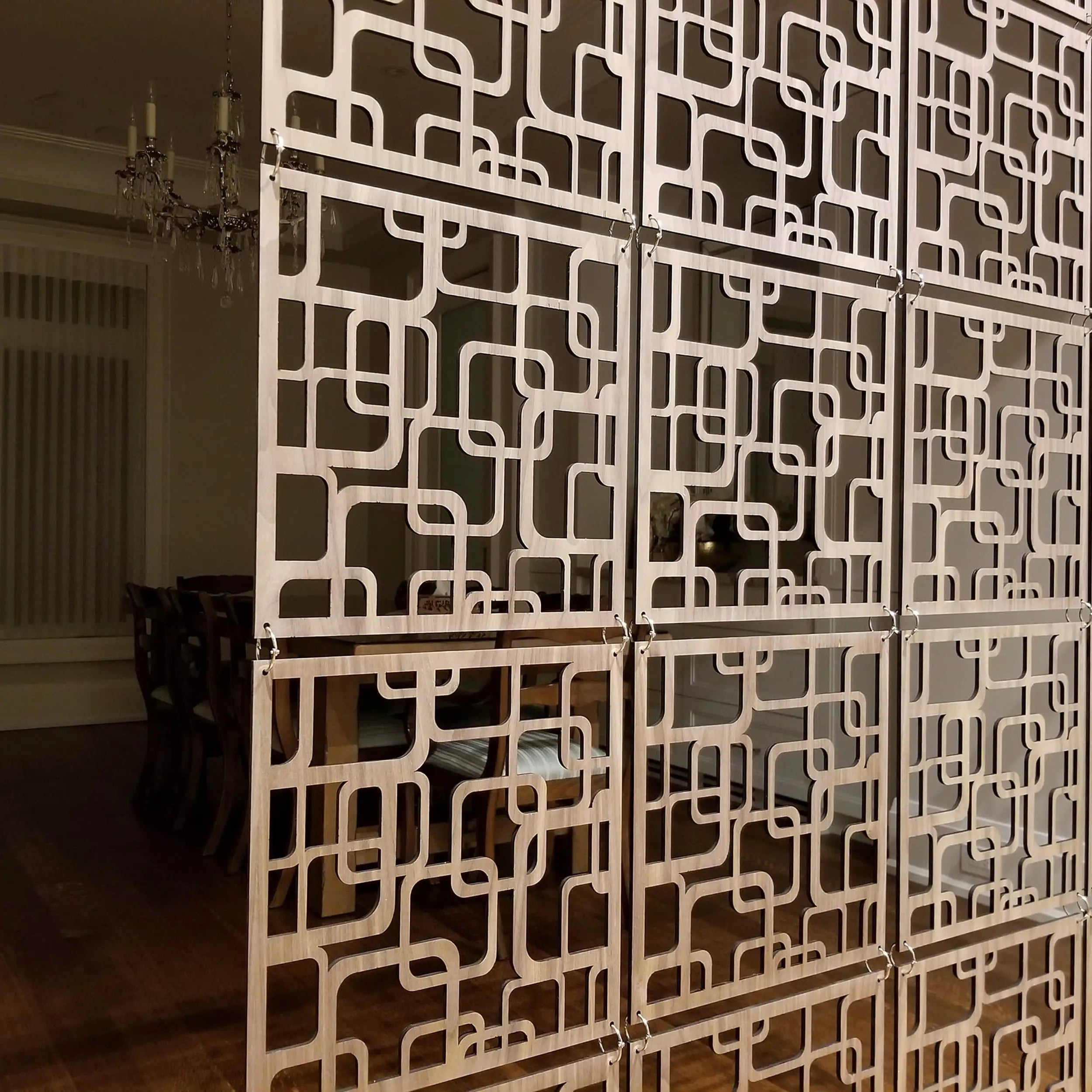 Decorative screen with geometric pattern in a room setting