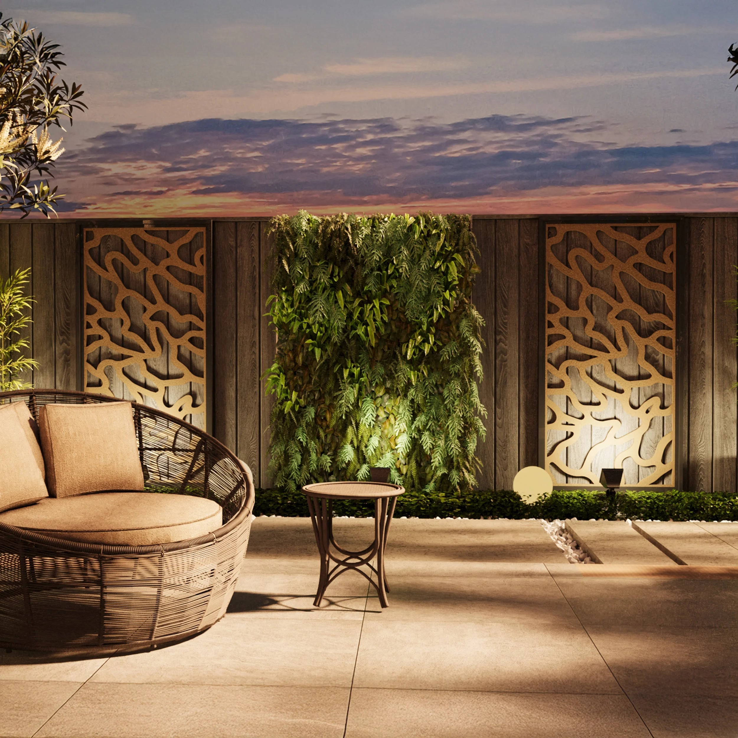 Outdoor patio with wicker furniture, table, and decorative wall panels during sunset.