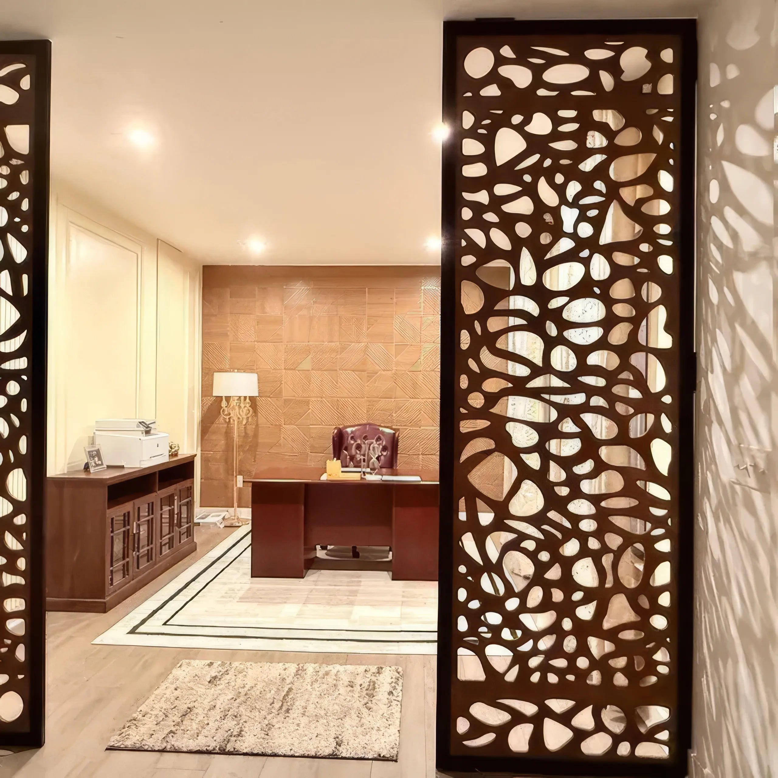 Decorative room divider with cut-out patterns in an office setting
