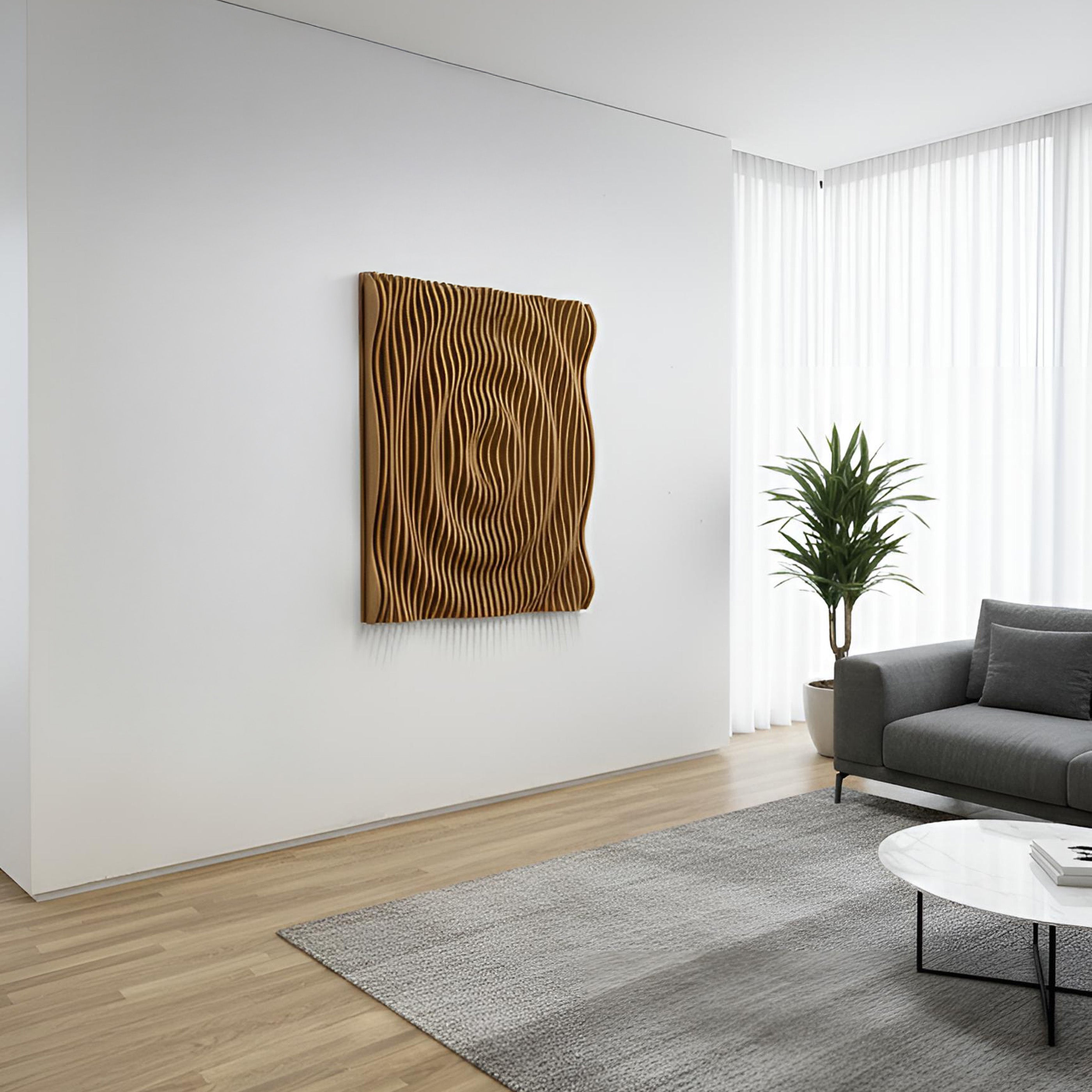 Modern living room with a textured wall art piece, gray sofa, and a plant.