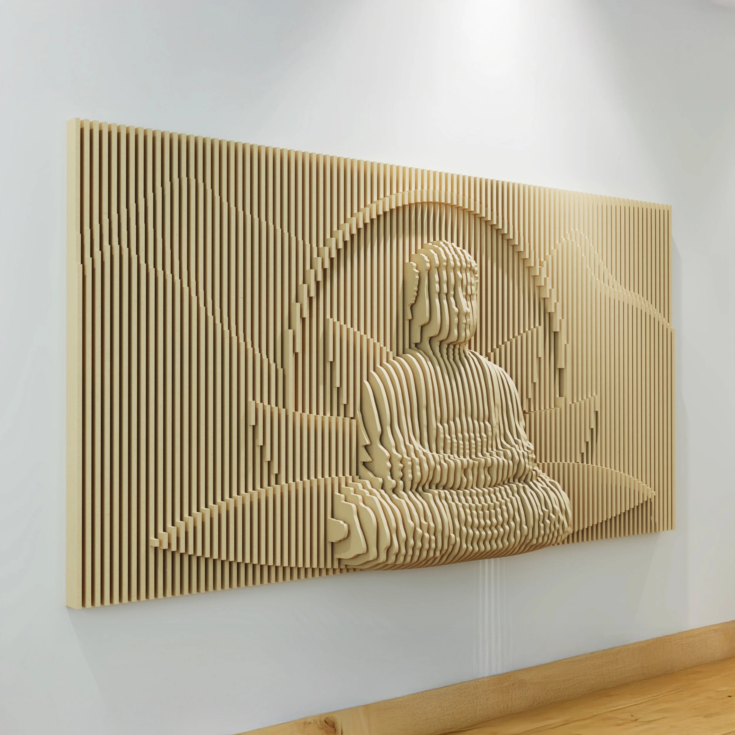 Wooden wall art depicting a seated figure in a meditative pose on a white wall.