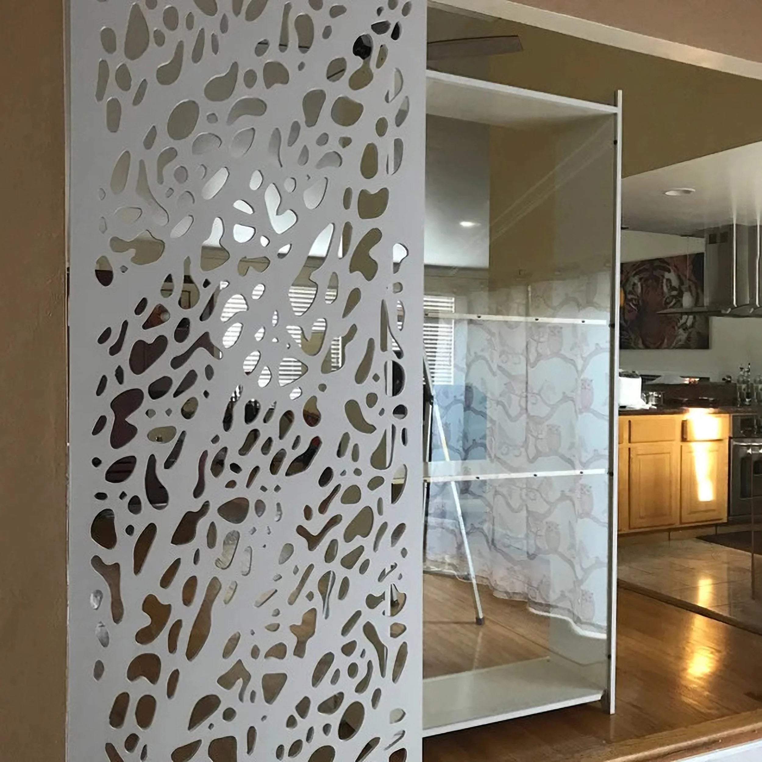 Decorative screen with cut-out pattern in a modern interior setting