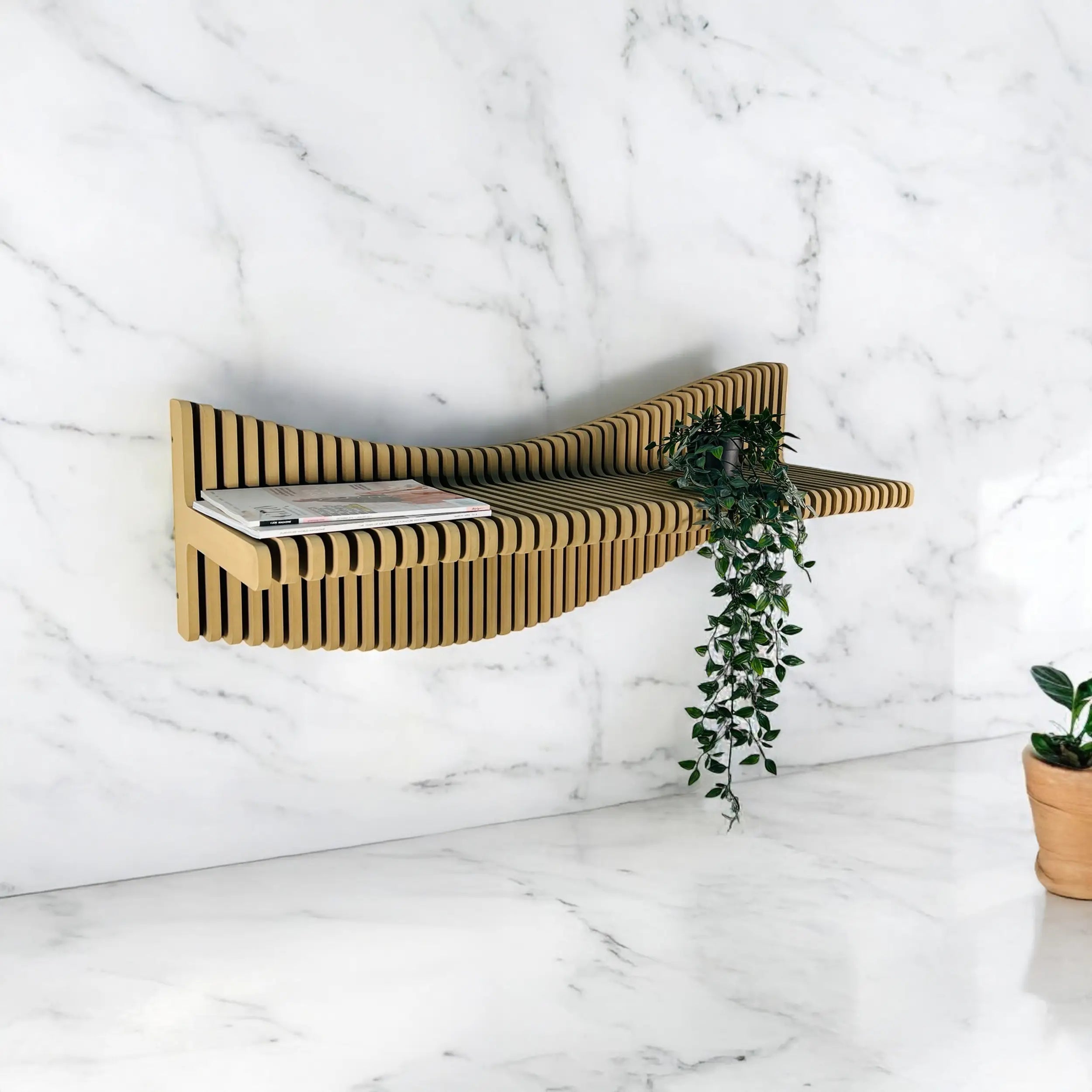 Wooden shelf with a magazine against a marble wall