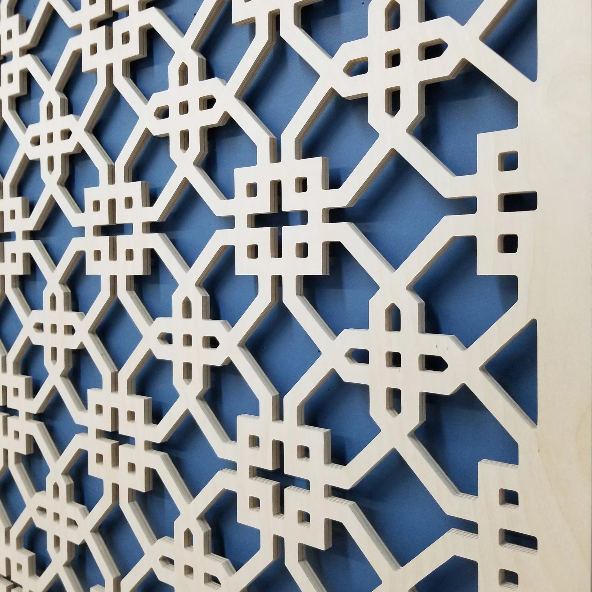 Decorative white lattice pattern on a blue background
