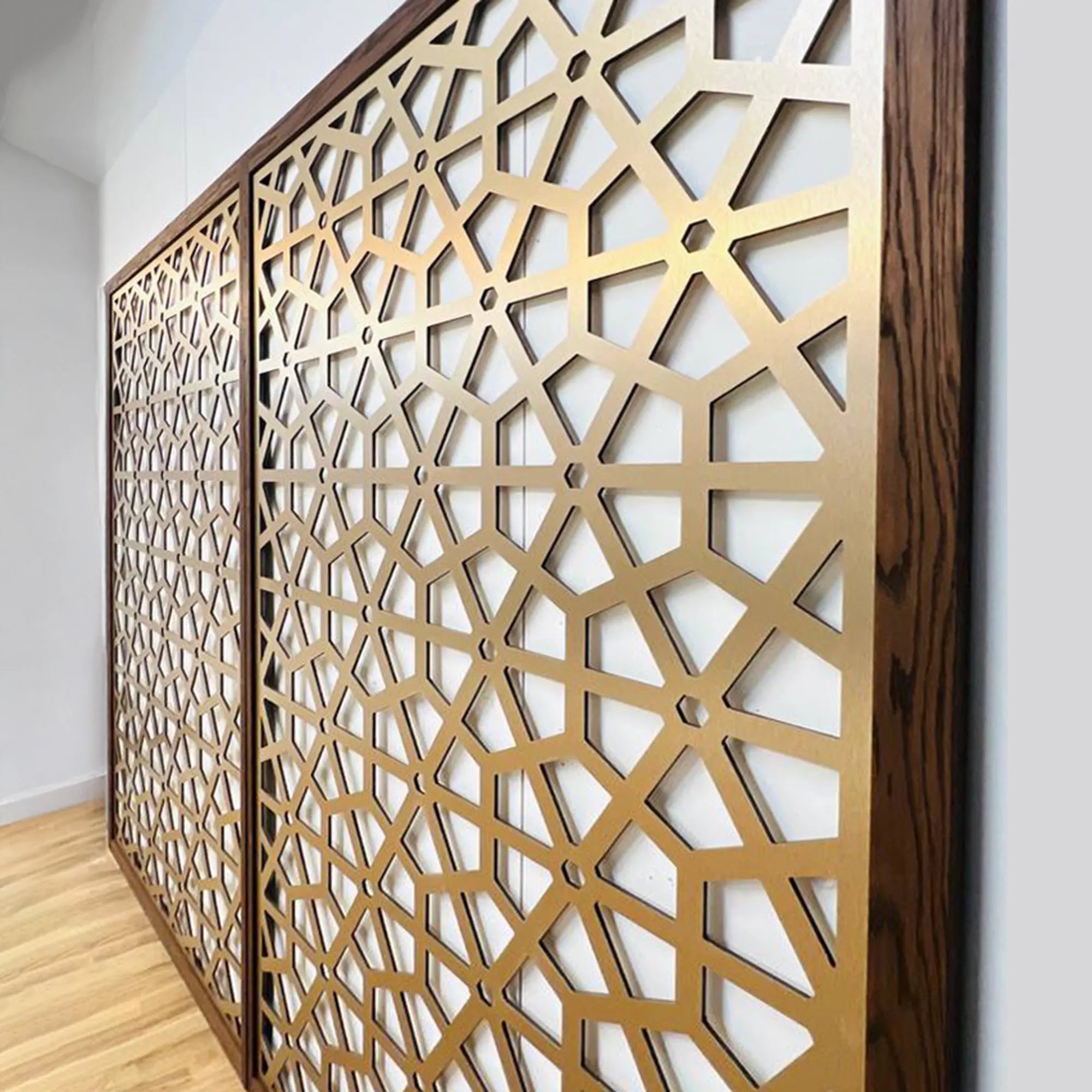 Decorative metal screen with geometric pattern in a room setting