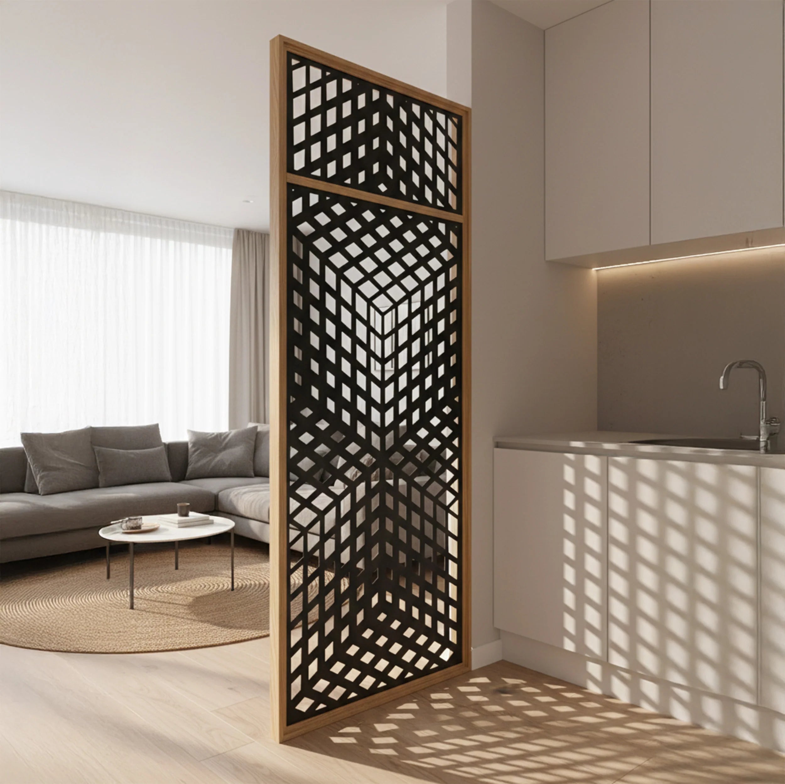 A modern black geometric lattice screen divider with a light wood frame, standing in a bright, contemporary kitchen and living room setting.