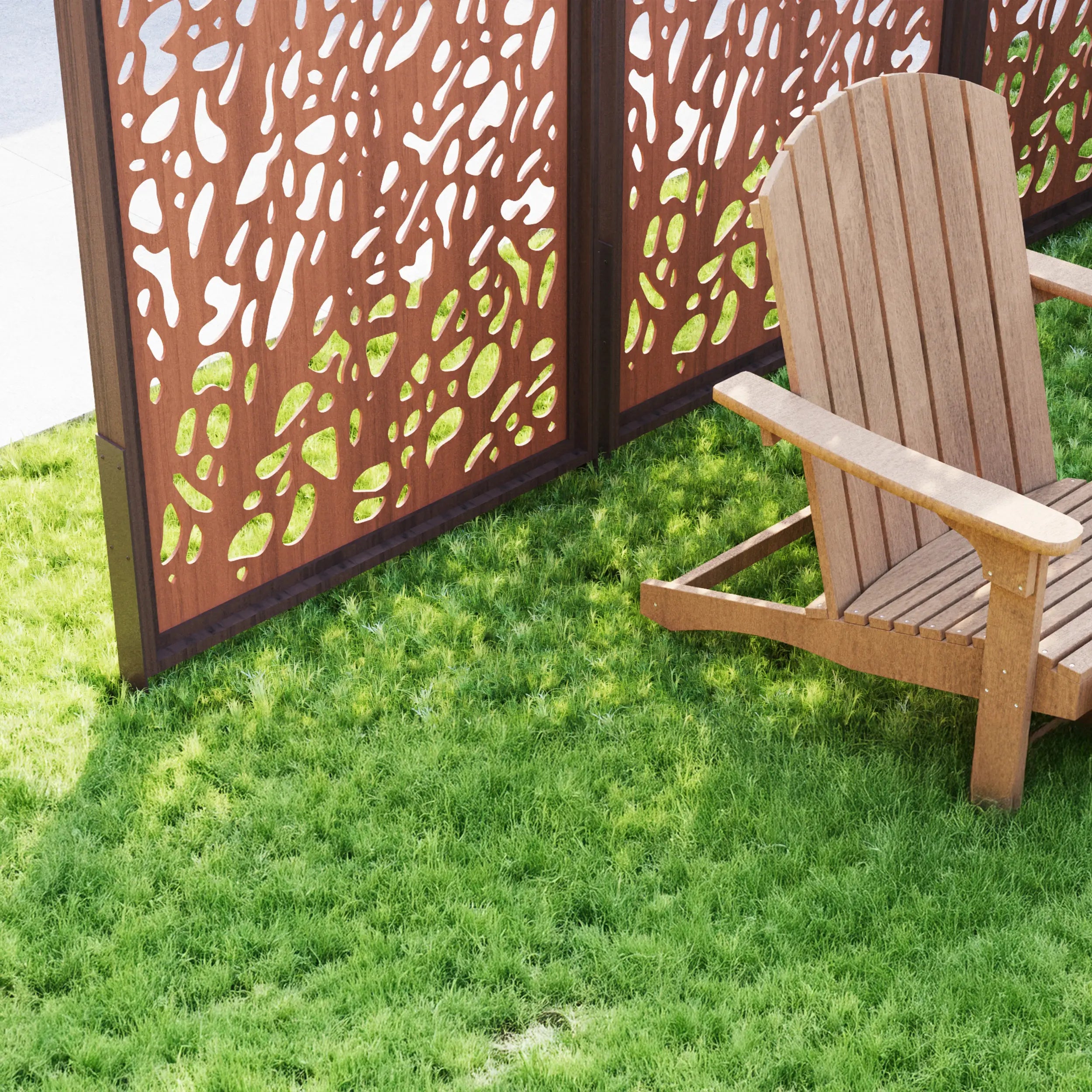 Wooden Adirondack chair next to a decorative outdoor screen on grass
