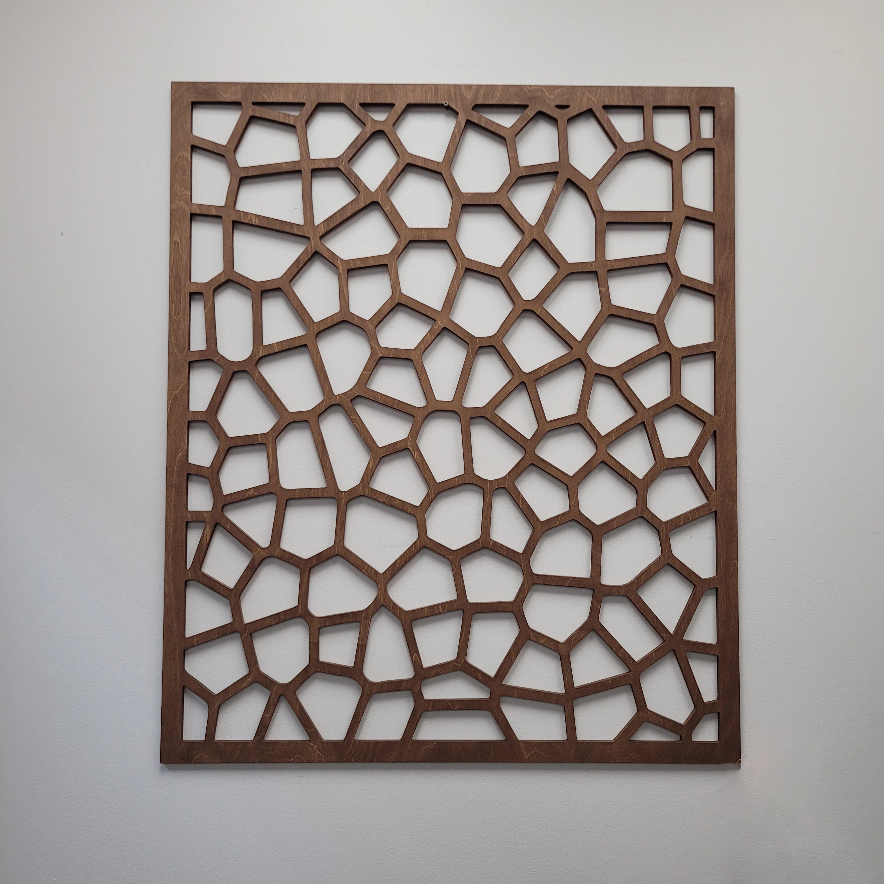 Wooden lattice panel on a plain background