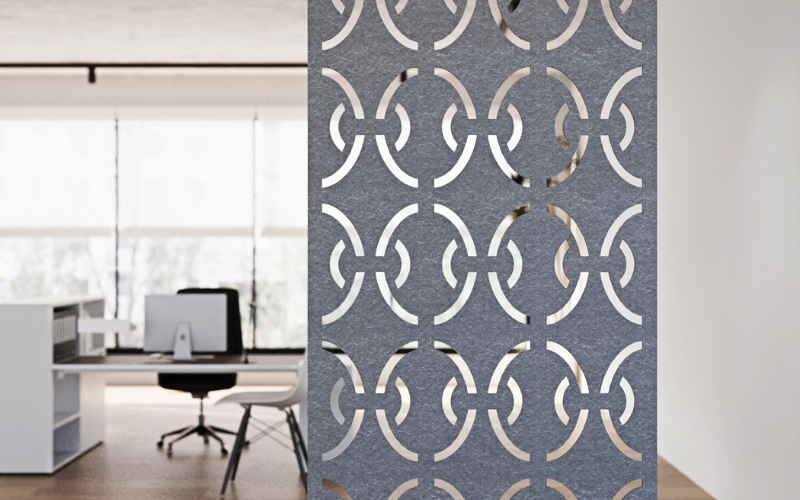Decorative screen with geometric pattern in an office setting