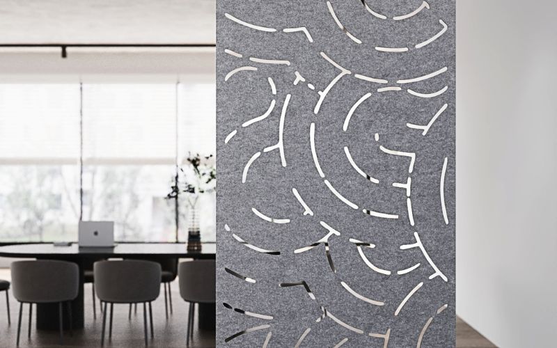 Room divider with geometric pattern in a modern interior setting