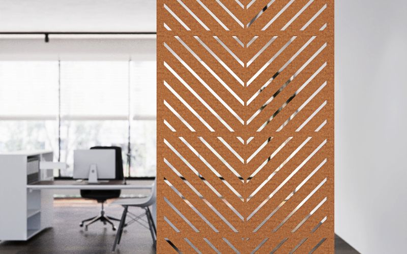 Wooden room divider with geometric pattern in an office setting