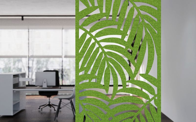 Green leaf-patterned room divider in an office setting