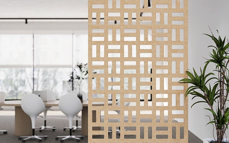 Decorative screen in an office setting with tables and chairs.
