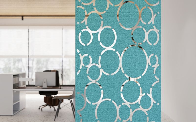 Decorative screen with geometric pattern in an office setting