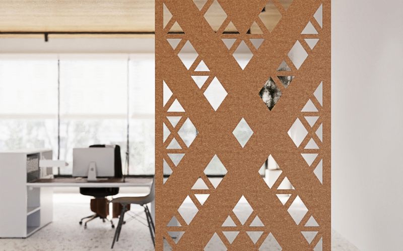 Decorative screen with geometric pattern in an office setting