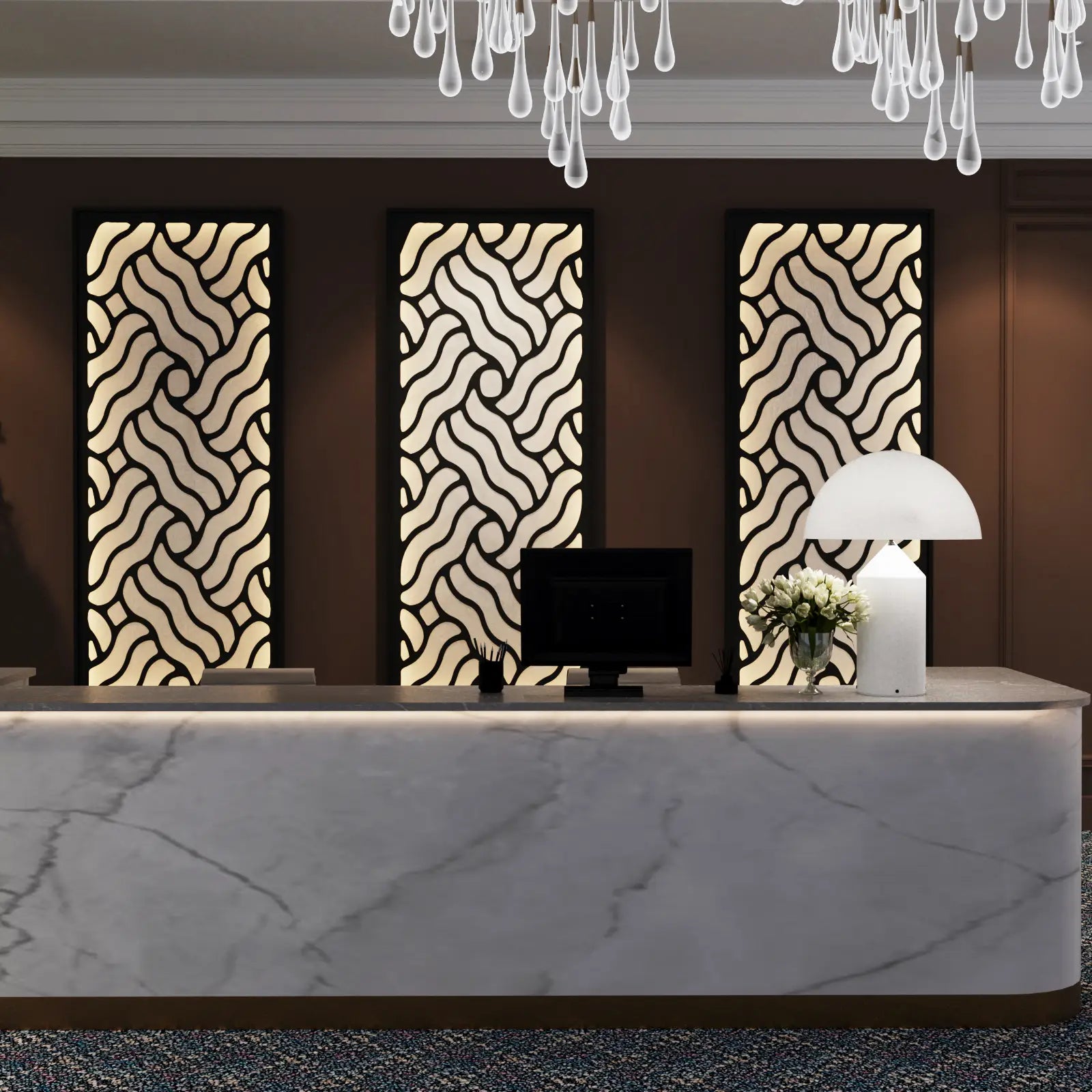 Modern interior design with a marble reception desk, decorative wall panels, and a chandelier.