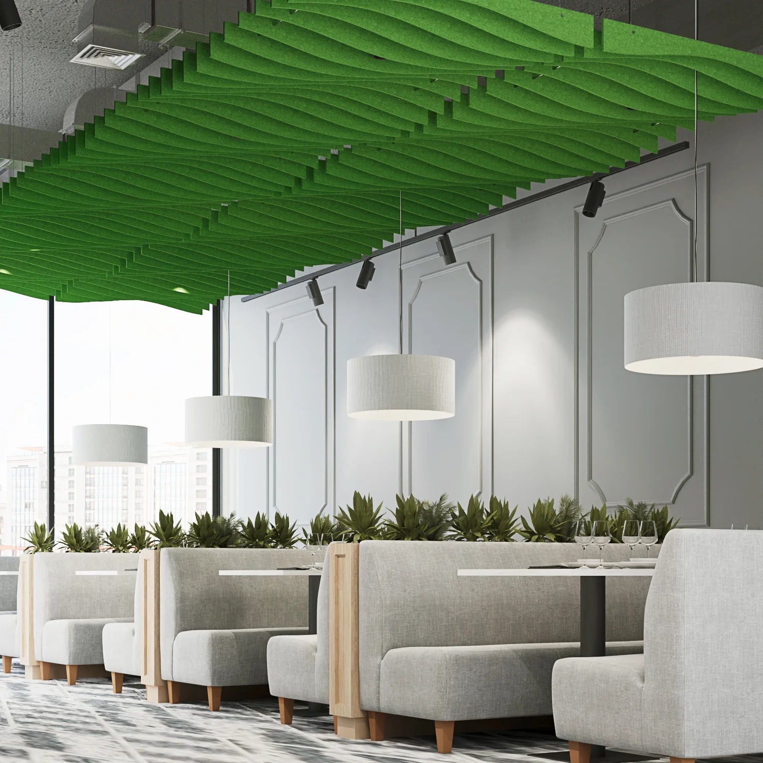 Modern office interior with green acoustic panels on the ceiling, gray walls, and gray furniture.