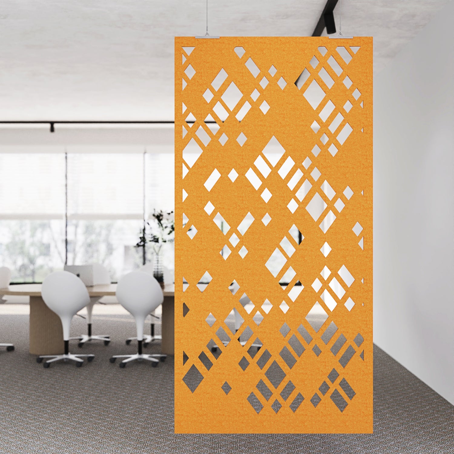 Decorative orange screen with geometric pattern in an office setting