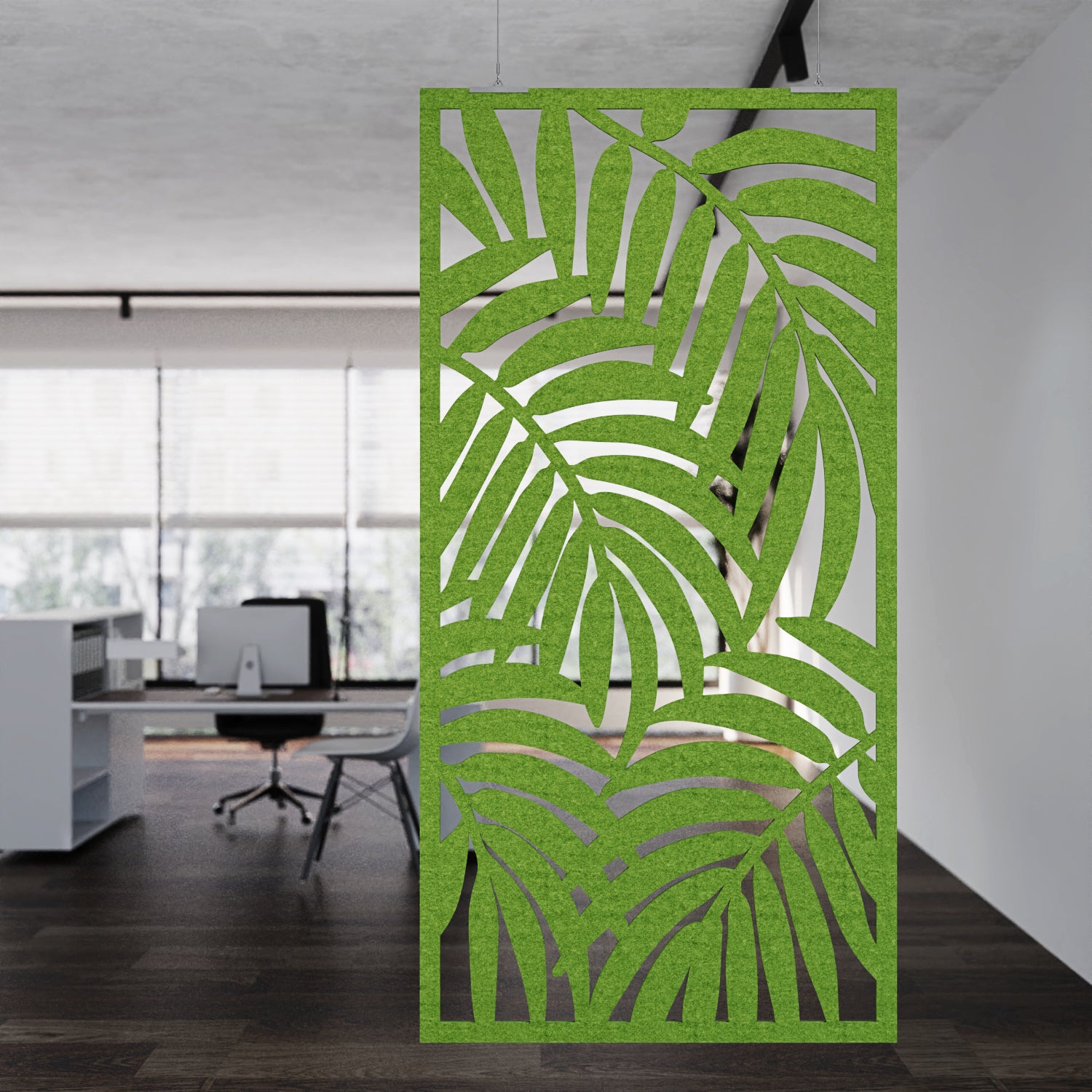 Green leaf-patterned screen in an office setting