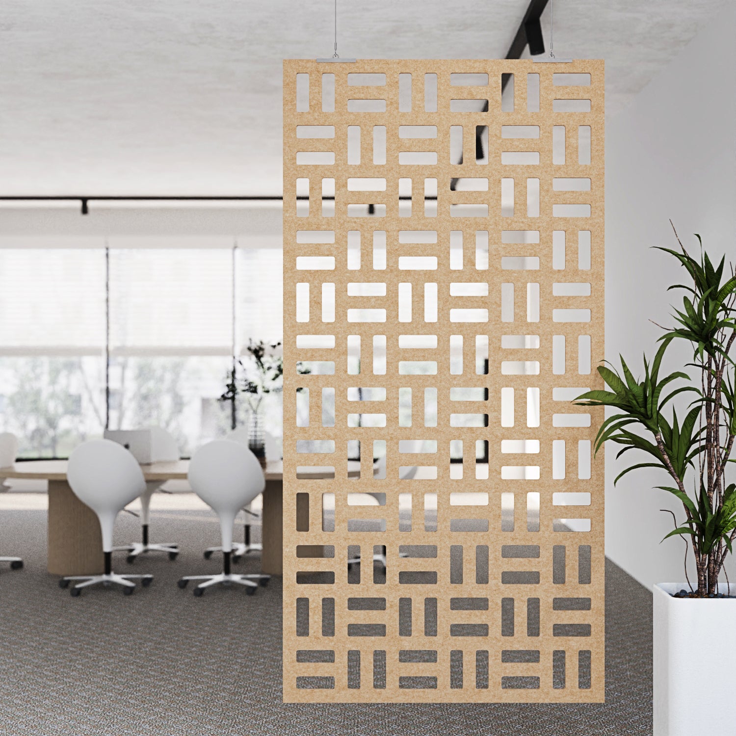 Wooden decorative screen in an office setting with tables and chairs.