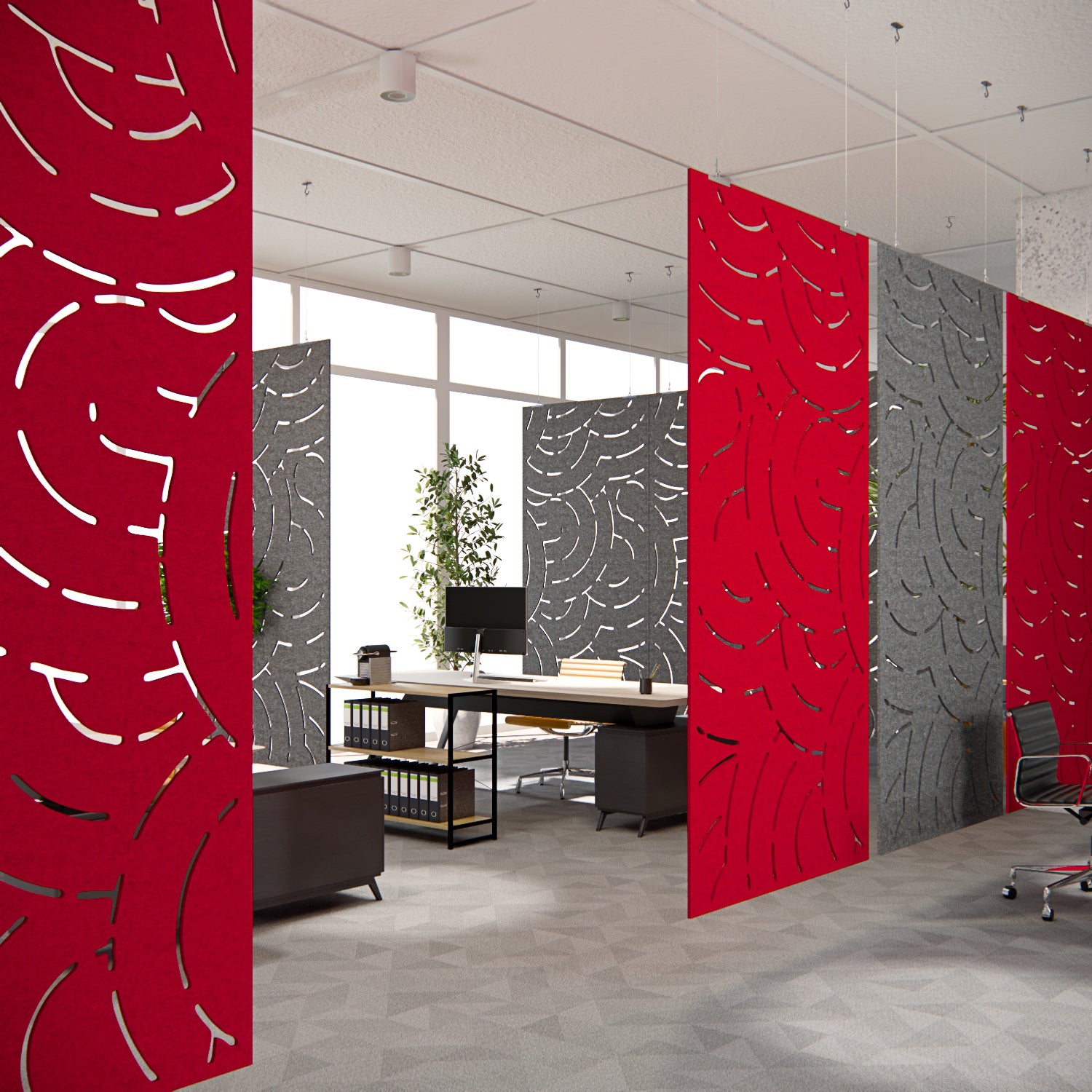 Modern office with red and gray patterned room dividers.