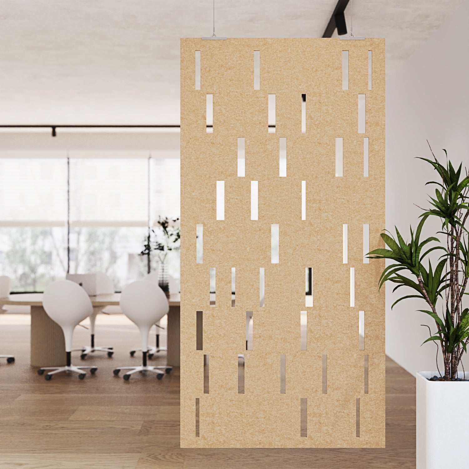 Beige perforated screen in an office setting with tables and chairs.
