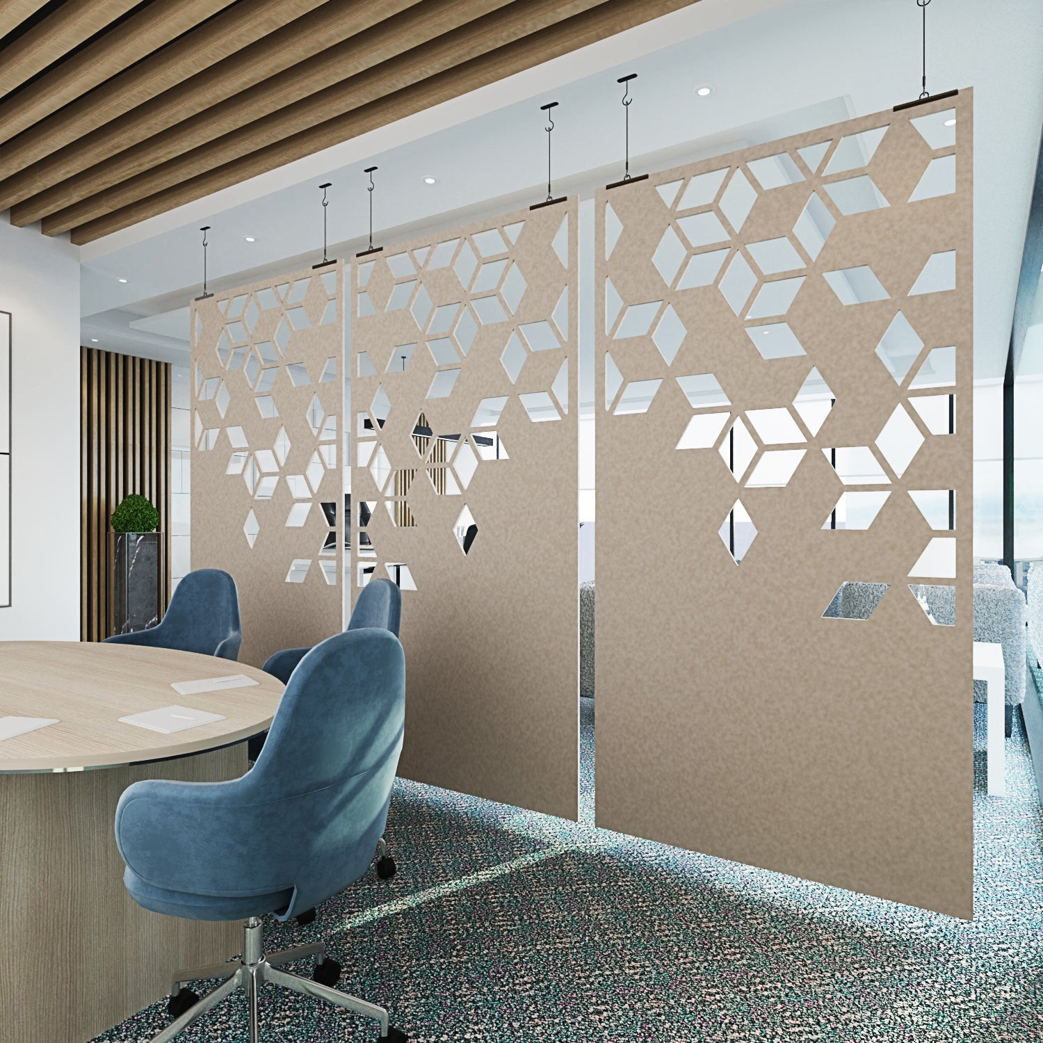 Modern office space with decorative partition walls and blue chairs.