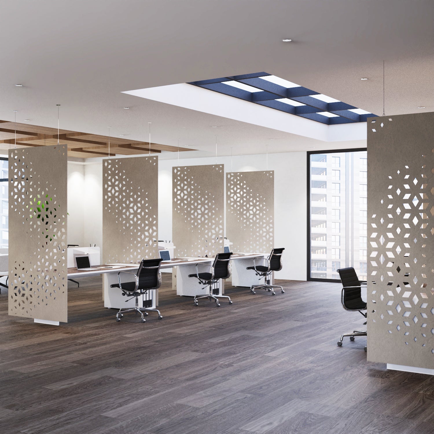 Modern office space with perforated partition walls and desks.
