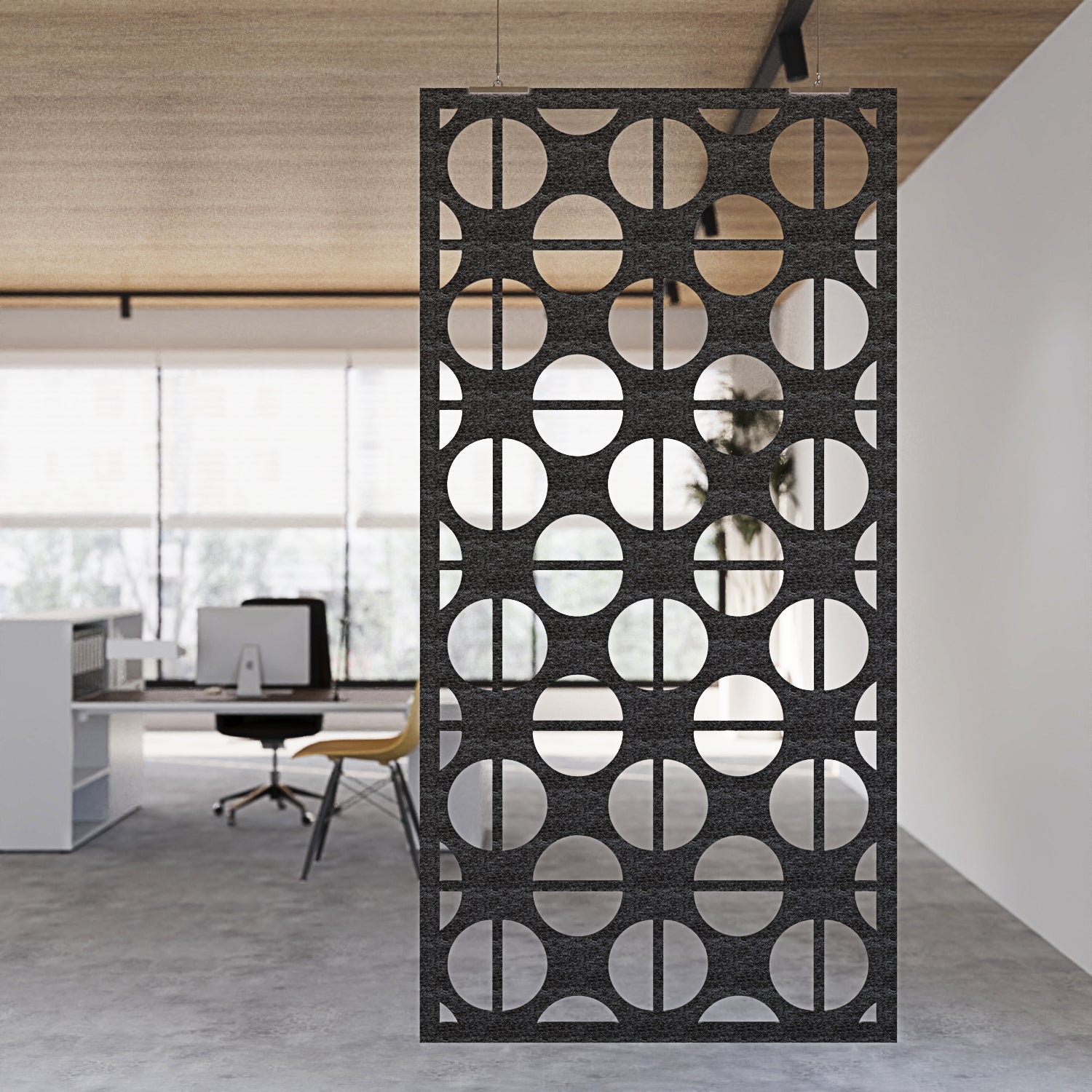 Decorative screen with geometric pattern in an office setting