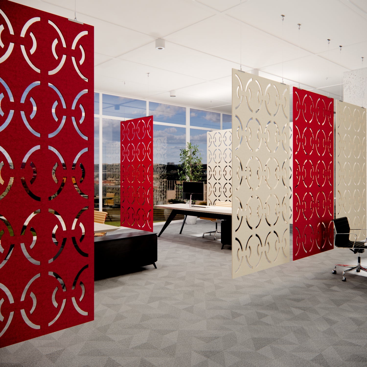 Modern office space with red and white patterned room dividers.