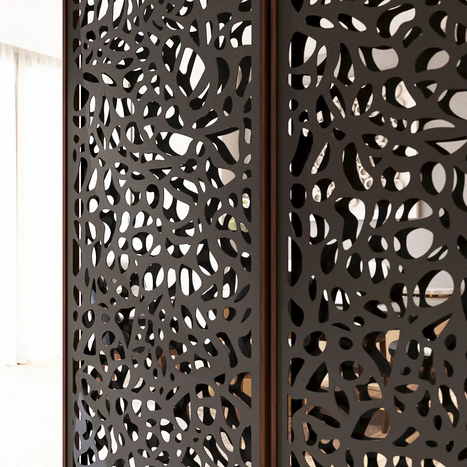Decorative metal screen with intricate cut-out design