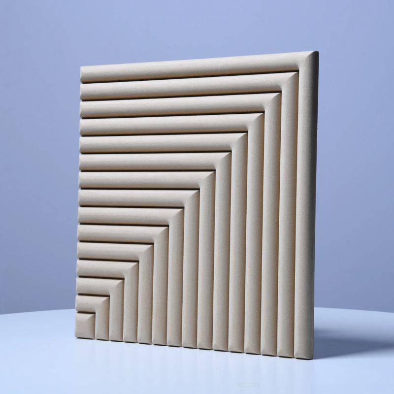 Stack of beige textured acoustic panels on a light blue background