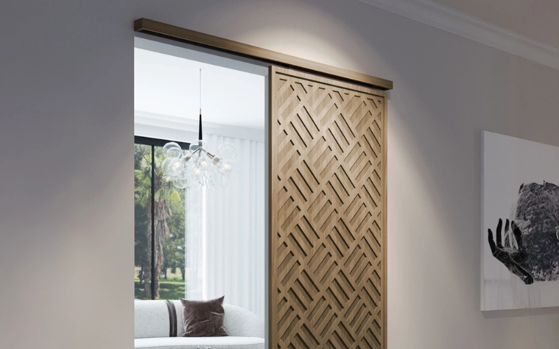 Wooden sliding door with geometric pattern in a modern interior setting