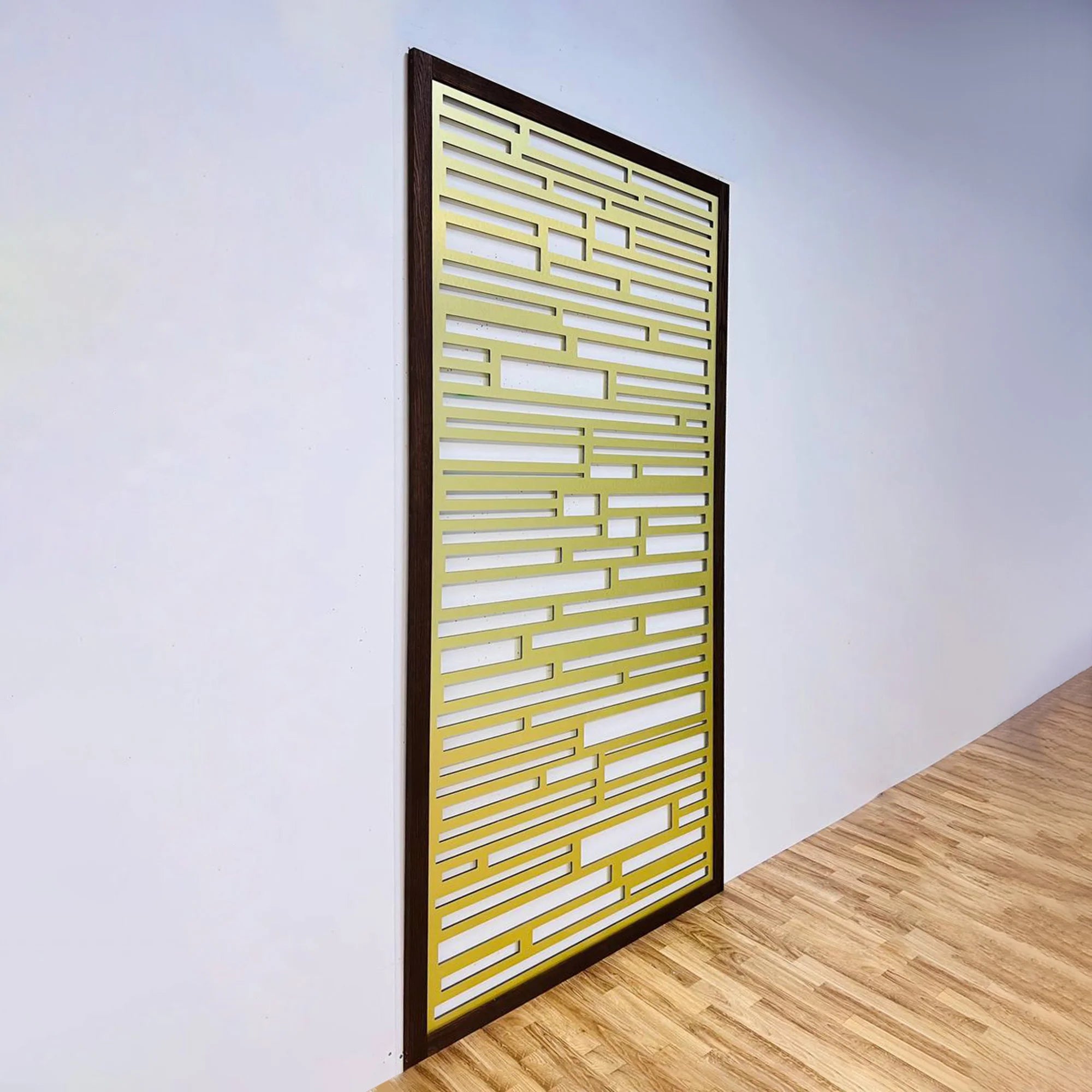 Decorative screen with geometric pattern on a white wall