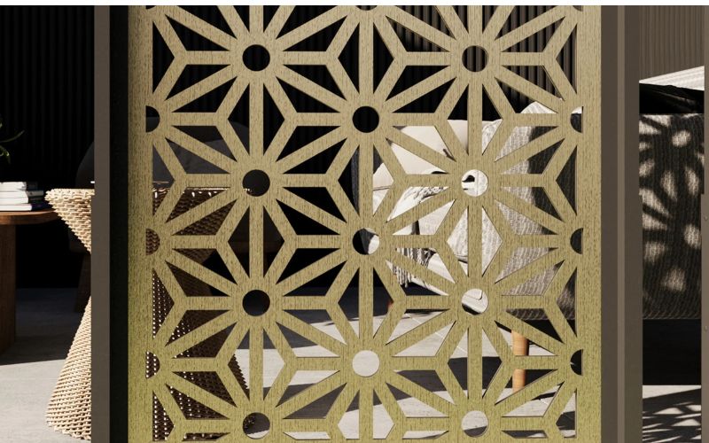 Decorative metal screen with geometric pattern in an outdoor setting