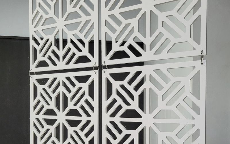 Decorative screen with geometric pattern on a gray background