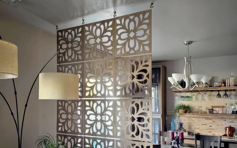 Decorative wall panel with floral patterns in a room setting.