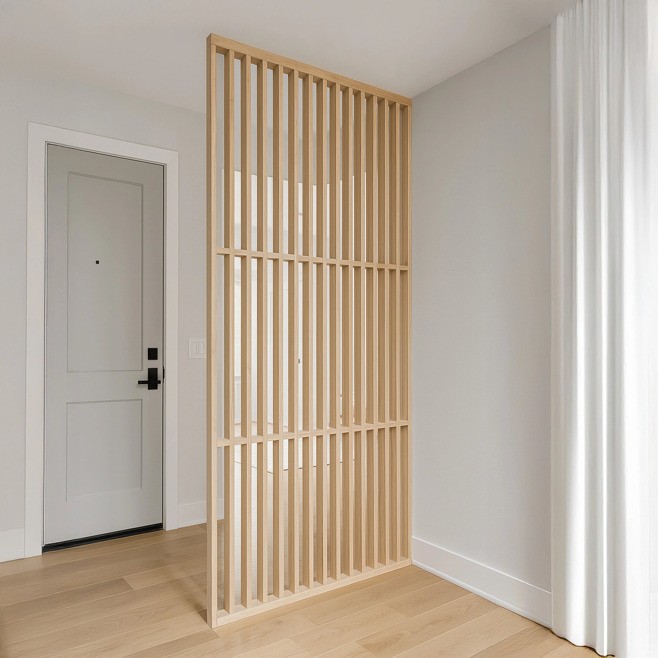 Wooden slat room divider in a minimalistic room with light wood flooring and white walls.