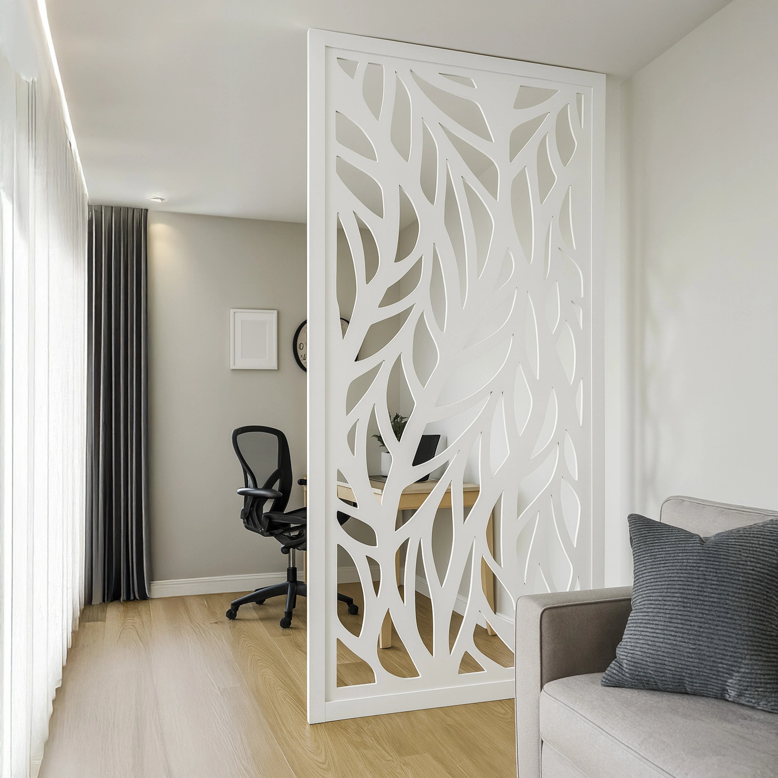 Decorative white room divider in a modern living space with a sofa and chair.