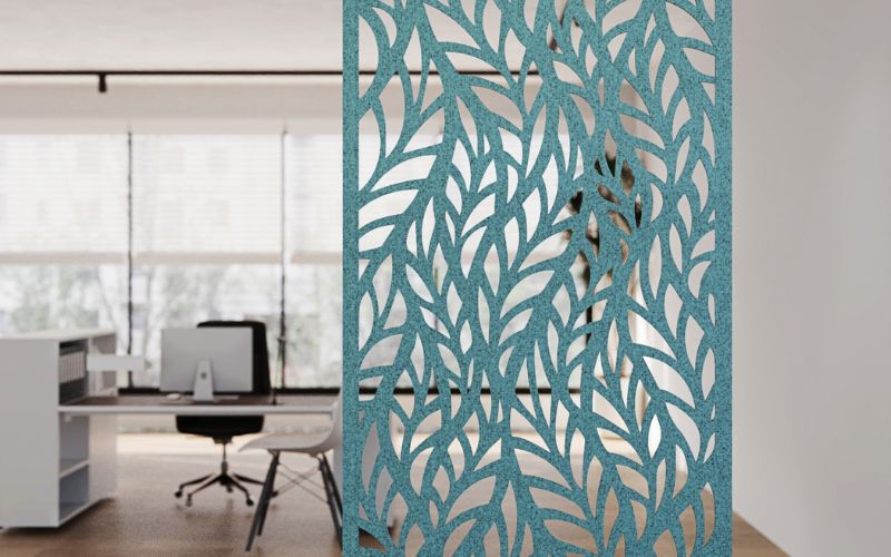 Decorative screen with laser-cut patterns in an office setting
